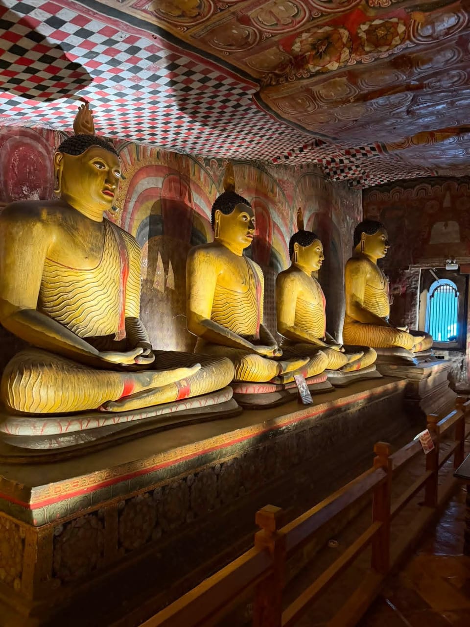 Seated Buddha statues inside Dambulla Cave Temple