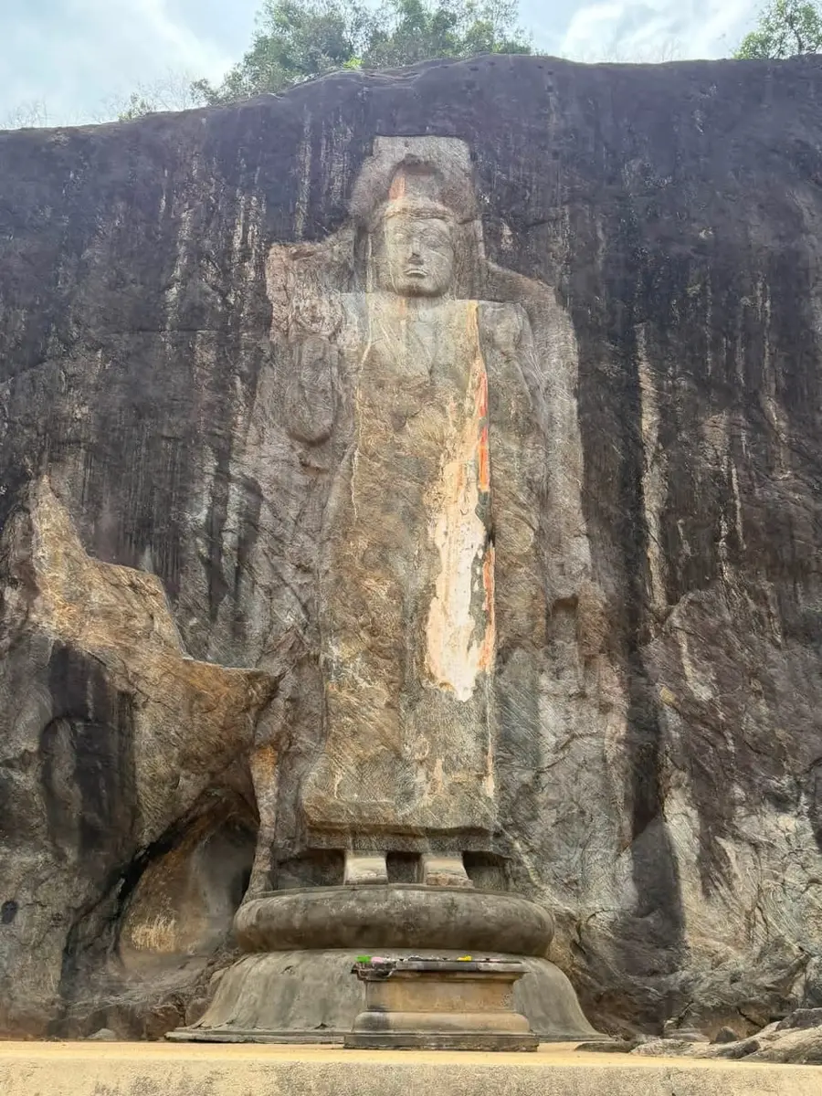 Ancient standing Buddha carved into the rock at Buduruwagala
